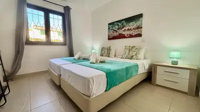 a bedroom with a bed and a window at Vilamoura Grand Terrace 2 by Homing in Vilamoura