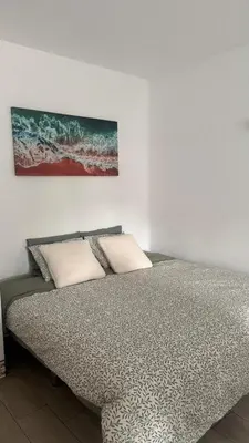 a kitchen with white cabinets and a sink at My Cozy Oura Studio in Albufeira