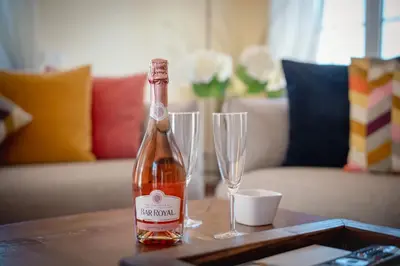 a bottle of wine and two glasses on a table at Villa Serena in Almancil