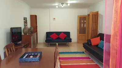 a living room with a couch and a table at Albufeira - T2 Old Town Central - 200m Beach in Albufeira