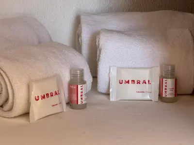 a small bedroom with a bed with two plates on it at Cerro Atlantico by Umbral in Albufeira
