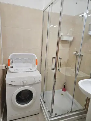 a bathroom with a toilet and a sink at TMP Apartamento in Quarteira