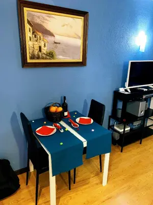 a blue table with food and a bottle of wine at Forte Apartment in Albufeira