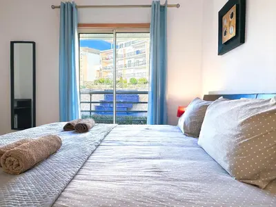 a bedroom with a large bed with a window at Luxury Apartment Ocean View by Be Cherish in Páteo
