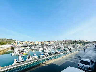 a marina filled with lots of boats in the water at Vila D'Alba - Sem Stress in Albufeira