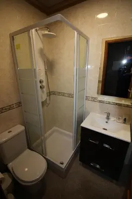 a bathroom with a shower and a toilet and a sink at Villa Summertime - Private Jacuzzi and bikes, beach 800m in Albufeira