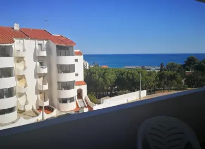 a view of the ocean from the balcony of a building at Vista Mar Apartamento in Albufeira