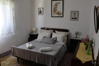 a bedroom with a bed with two towels on it at Casa Portuguesa in Albufeira