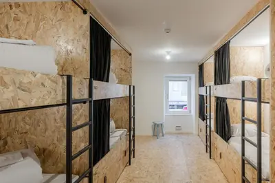 a group of bunk beds in a room at Hostel Conii & Suites Algarve in Quarteira