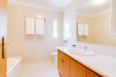 a white bathroom with a sink and a toilet at AL- Apartamentos Novos Vista Mar in Quarteira