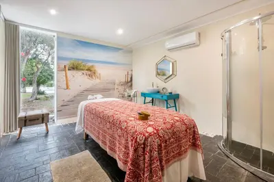 a bedroom with a bed and a glass shower at Vilar do Golf in Quinta do Lago