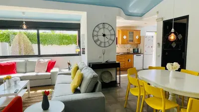 a living room with a couch and a table at Strip by Check-in Portugal in Albufeira