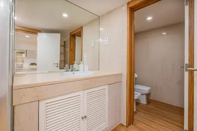 a bathroom with a sink and a toilet at Marina Vilamoura Triplex in Vilamoura