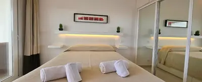 a bedroom with a bed with two towels on it at Golf & Mar - T2 Apartment in Vilamoura