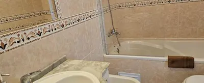 a bathroom with a toilet and a bath tub at Golf & Mar - T2 Apartment in Vilamoura