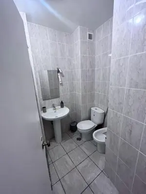 a bathroom with a toilet and a sink at Studio near the beach in Albufeira