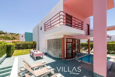 a villa with a swimming pool and a house at Villa AcquaMarina - 5 bedroom, water front villa in Albufeira