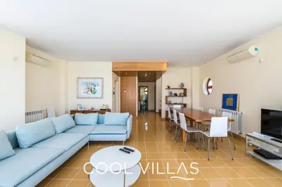 a living room with a blue couch and a table at Villa AcquaMarina - 5 bedroom, water front villa in Albufeira