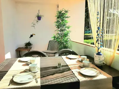 a table with plates and cups and a keyboard on it at Apartment Amalia in Albufeira