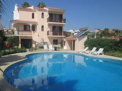 a large swimming pool in front of a house at Vivendas Costa in Barros da Fonte Santa