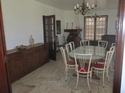 a dining room with a table and chairs at Vivendas Costa in Barros da Fonte Santa