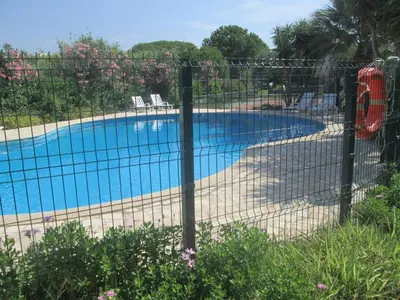 a fence in front of a swimming pool at Vivendas Costa in Barros da Fonte Santa