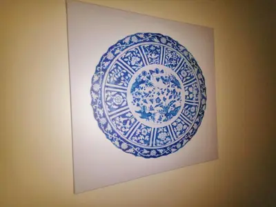 a blue and white plate hanging on a wall at Apartamento Penha T3 in Faro