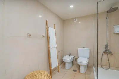 a bathroom with a toilet and a shower at Marina Vilamoura Relax in Vilamoura
