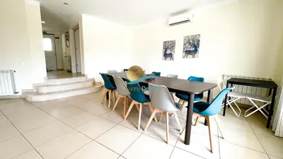 a living room with a bench and a table at Villa Clara Premium by Sunny Deluxe in Albufeira