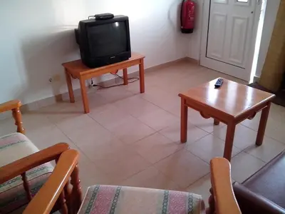 a living room with a tv and a coffee table at Iconic Apartment with 2 Bedrooms in Albufeira