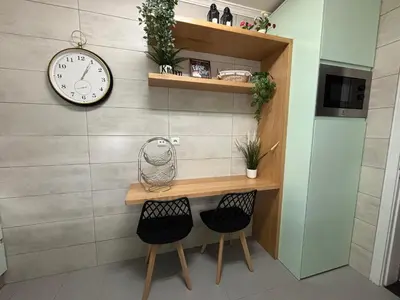 a living room with a tv and a table at Timeless Vacations Vilamoura Marina Flat WIFI & Pool in Vilamoura