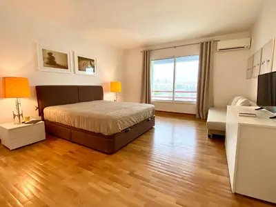 a bedroom with a bed and a large window at Home Out Luxury Marina Apartment - 2 Bedrooms Sea View in Vilamoura
