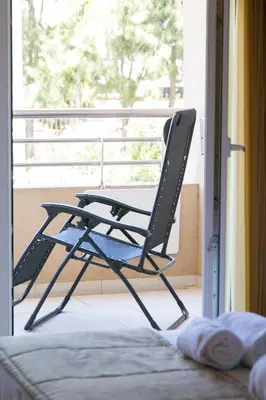 a bedroom with a large bed with a window at Quinta da Barracuda by Golden Zenith in Albufeira