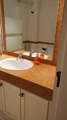 a bathroom counter with a sink and a mirror at Marina Vilamoura Apartment in Vilamoura