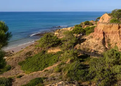a view of the beach from a cliff at 3HB Falésia Garden in Albufeira