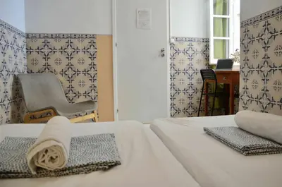 a bedroom with a bed and a window at RIA Terrace in Faro