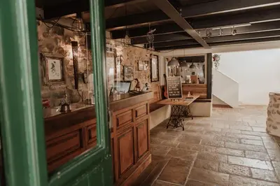 a kitchen with a sink and a counter in a room at Casa da Madalena Backpackers Hostel in Faro