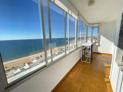 a room with a view of the beach and the ocean at 180° Sea View - Fabulosa vista mar! in Quarteira
