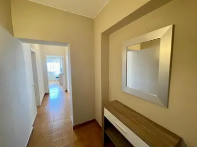 a room with a mirror on the wall and a hallway at 180° Sea View - Fabulosa vista mar! in Quarteira
