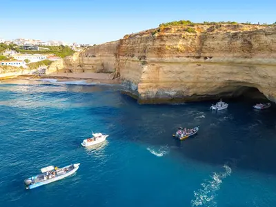a group of boats in the water near a cave at Villa Martinica by Algarve Vacation in Guia