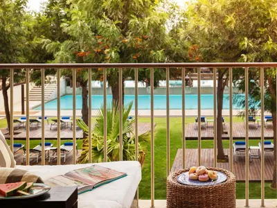 a table with a bowl of fruit on top of a balcony at Victoria Golf Resort and Spa Managed by Accor in Vilamoura