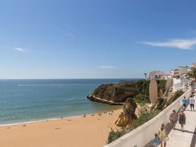 a group of people walking on a beach at Studio Dream View 50m from the beach by Interhome in Albufeira