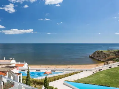 a view of the beach from the balcony of a resort at Studio Dream View 50m from the beach by Interhome in Albufeira