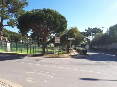 a street with a speed limit sign on the side of the road at Apartamento Falesia 6 B in Albufeira