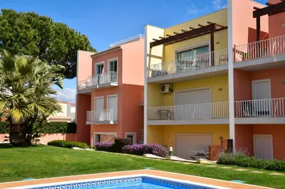 a building with a pool in front of it at Old Village Prestige 101 in Vilamoura