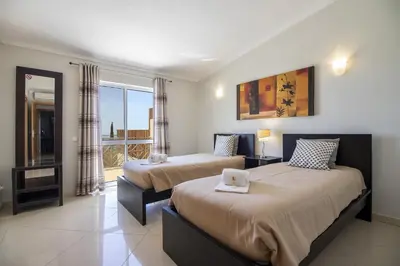 a hotel room with two beds and a window at Villa Vista in Valados
