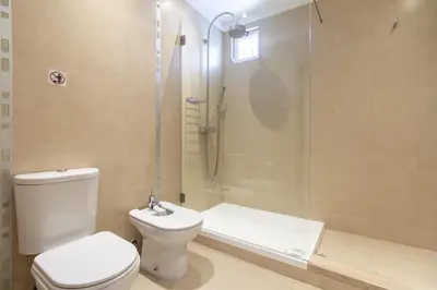 a bathroom with a sink and a shower at Villa Vista in Valados