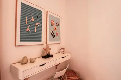 a room with a white dresser and a picture on the wall at Quinta do Paraíso - Bed&Shower in Albufeira