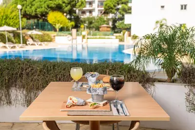 a group of small cups of food on a table at AP Victoria Sports & Beach in Albufeira