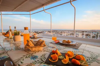 a table with food and drinks on top of a building at Penthouse Miami by Algarve Vacation in Albufeira